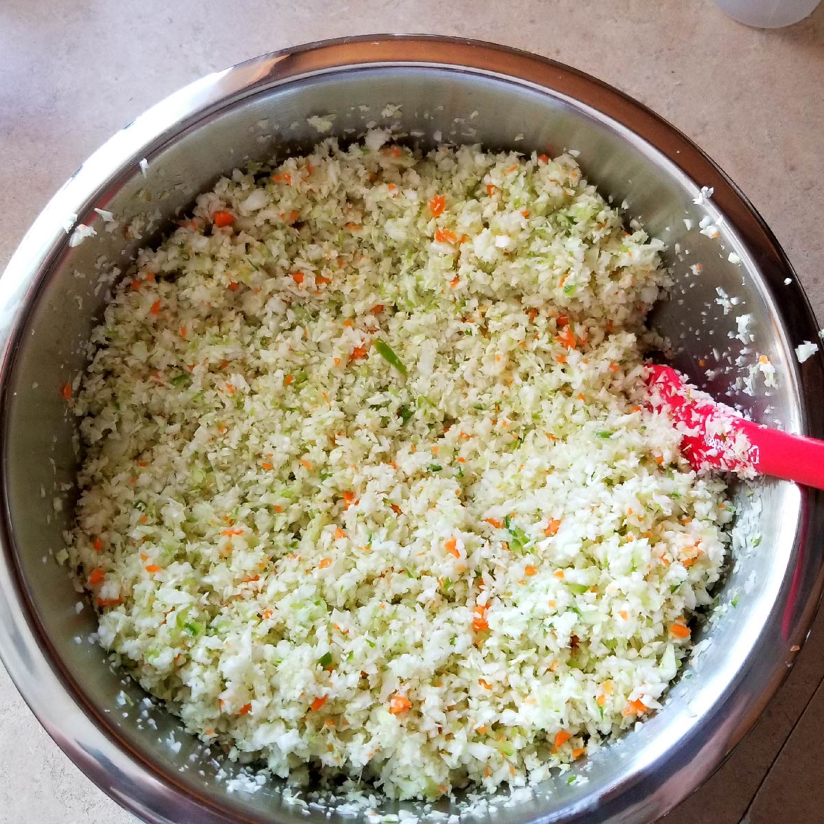 Cabbage, carrots and peppers in a bowl ready for the dressing. 