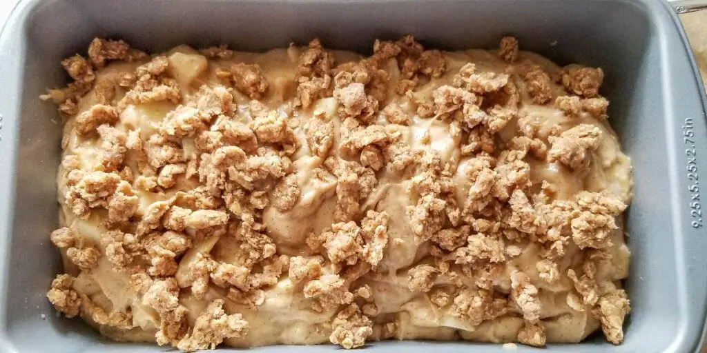 The streusel topping crumbled over the top of the batter in the pan