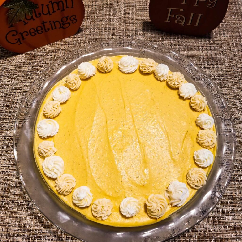 Pumpkin cheesecake in a glass pie dish