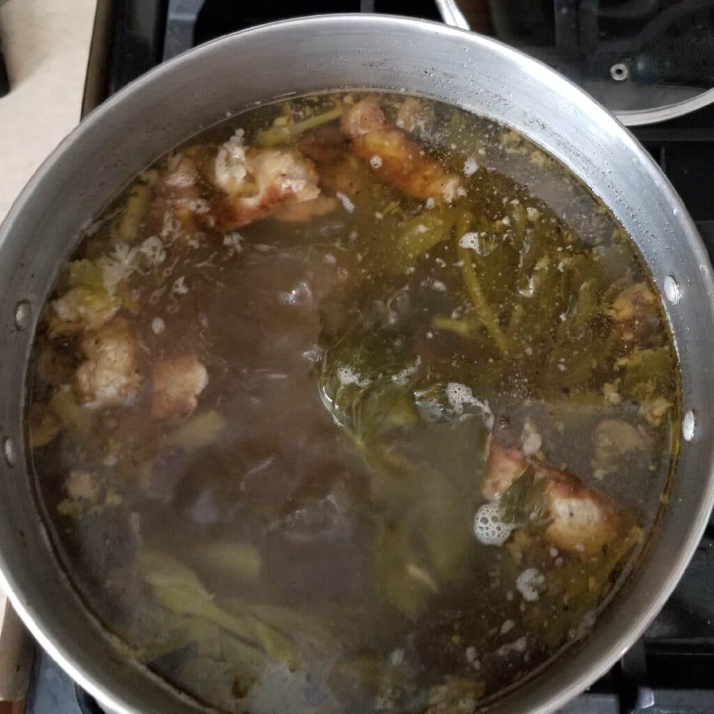 Bones and vegetables in water to make beef broth