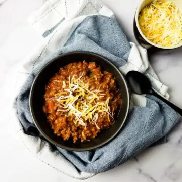chili in a bowl with cheese on top ready to be served
