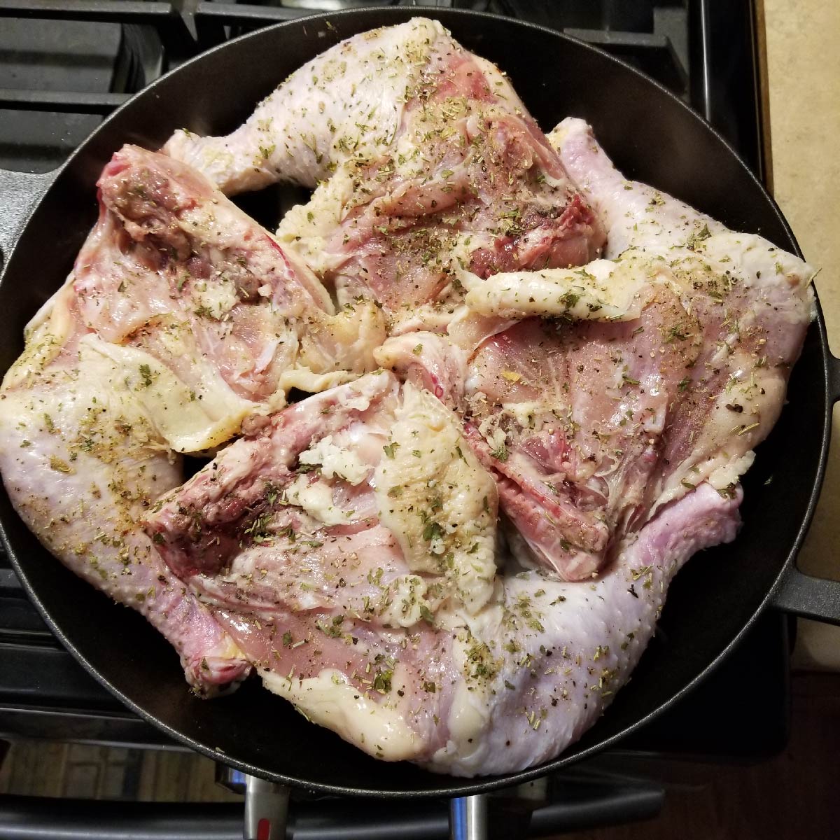 Leg quarters skin side down in the cast iron pan to fry the tops first.