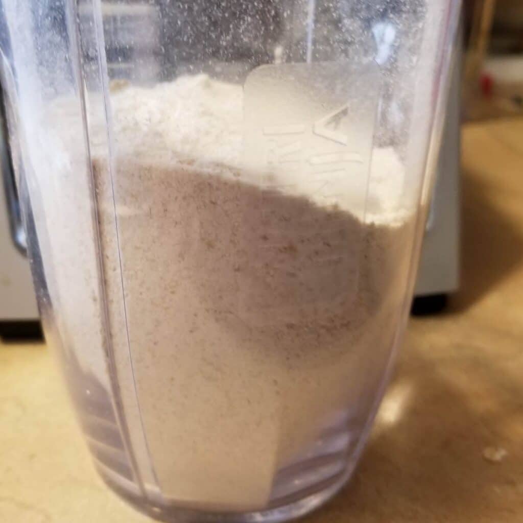 Homemade oat flour in a smoothie cup