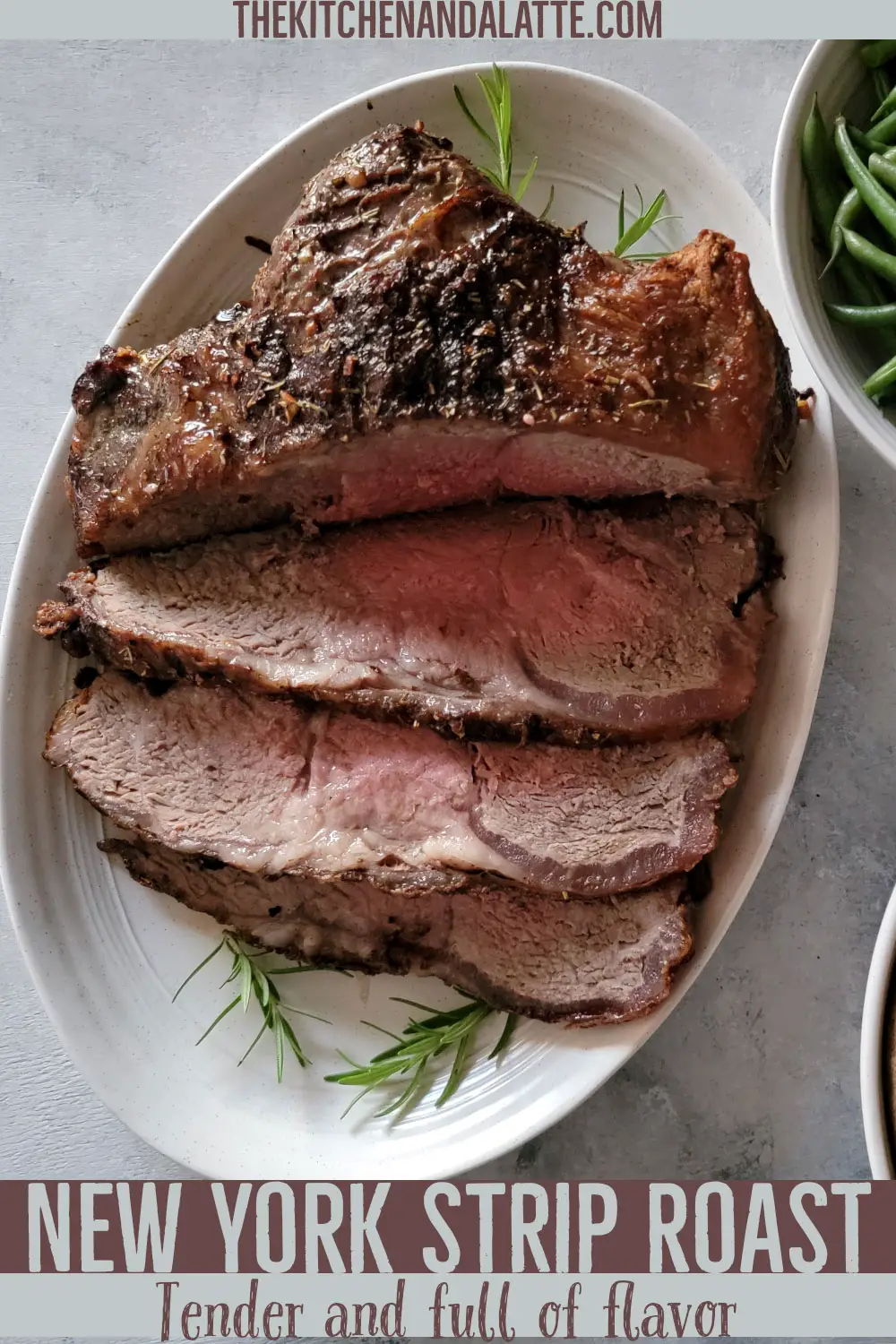 Pinterest image text New York Strip Roast tender and full of flavor. Picture of strip roast cut on a plate to serve.