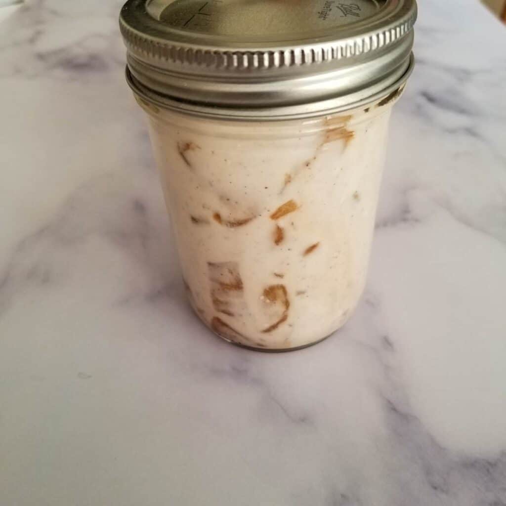 Apple pie yogurt mixed together in a half pint jar, ready to eat.