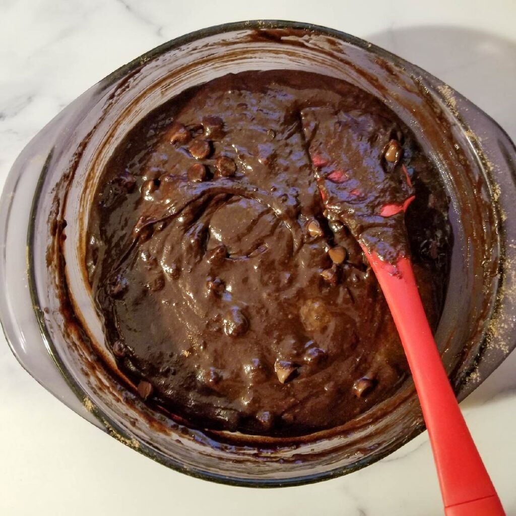 Brownie batter in the bowl so you can see how thick the batter should be