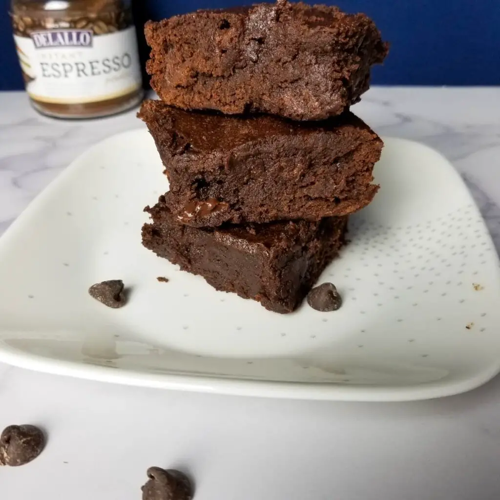 A plate of stacked brownies 