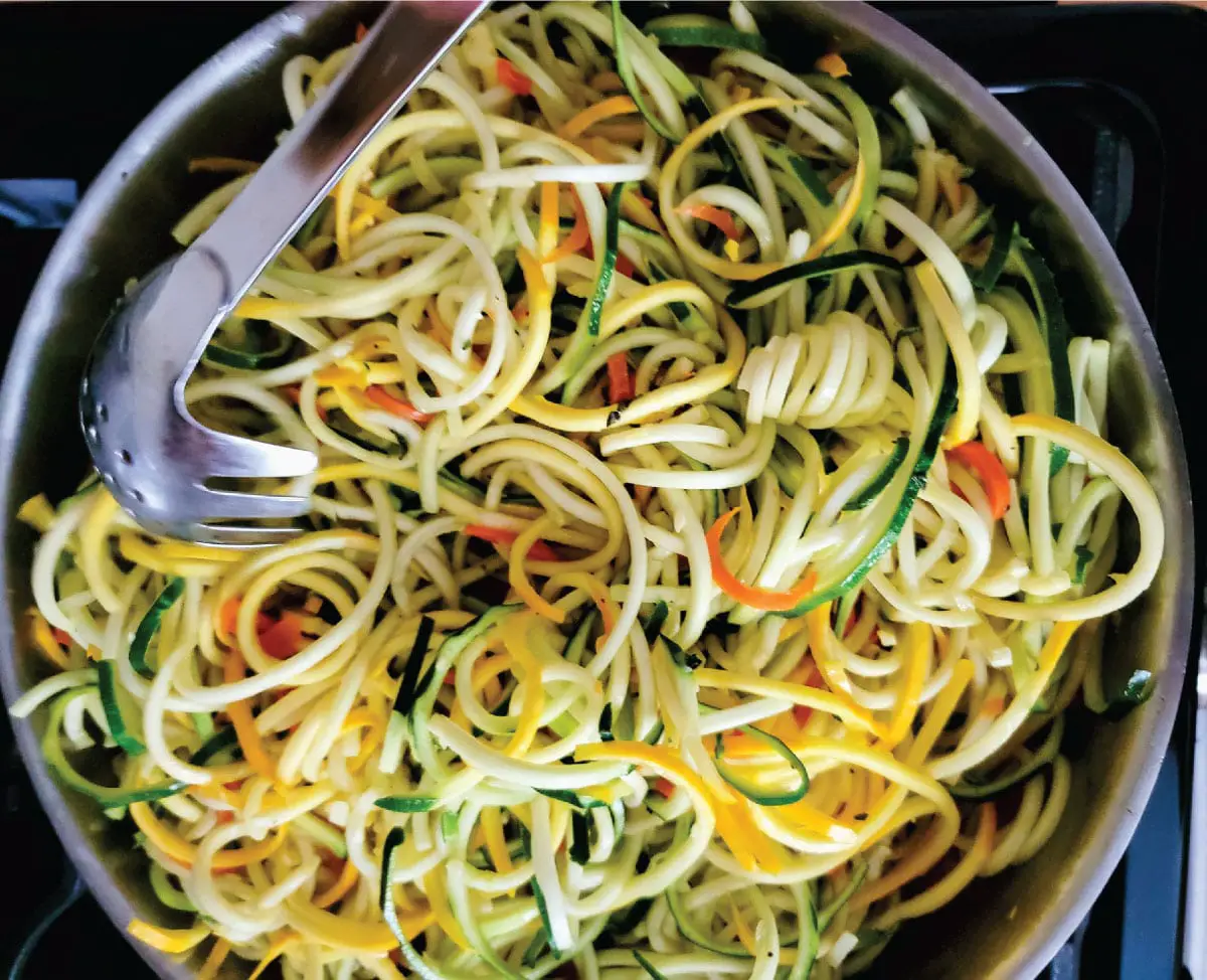 closeup of the cooked zucchini, squash and carrot noodles.