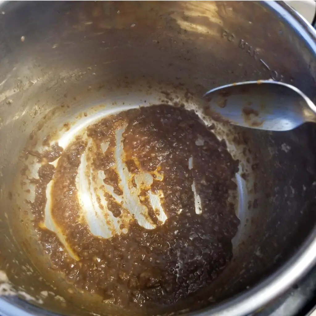 The gunk that was left behind after cooking the beef during the deglazing process