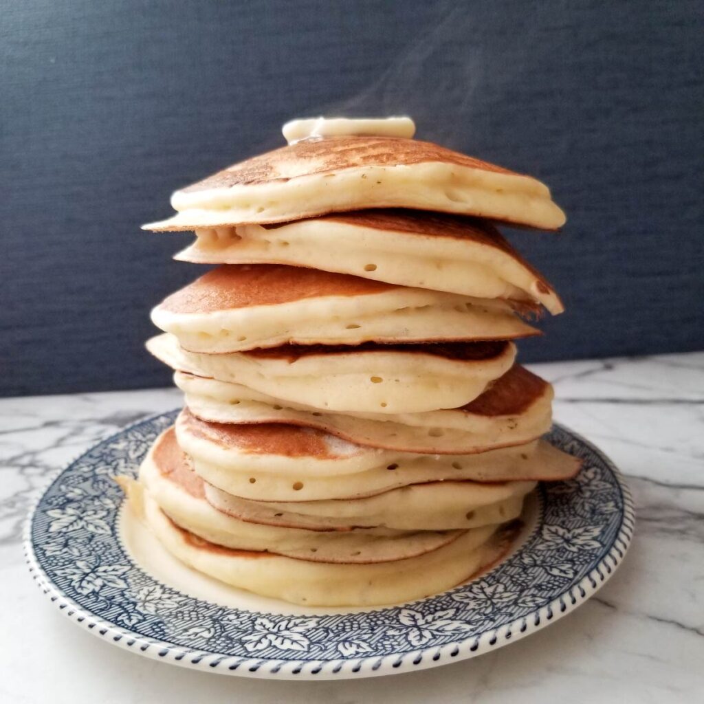 Large stack of pancakes after they have all cooked.