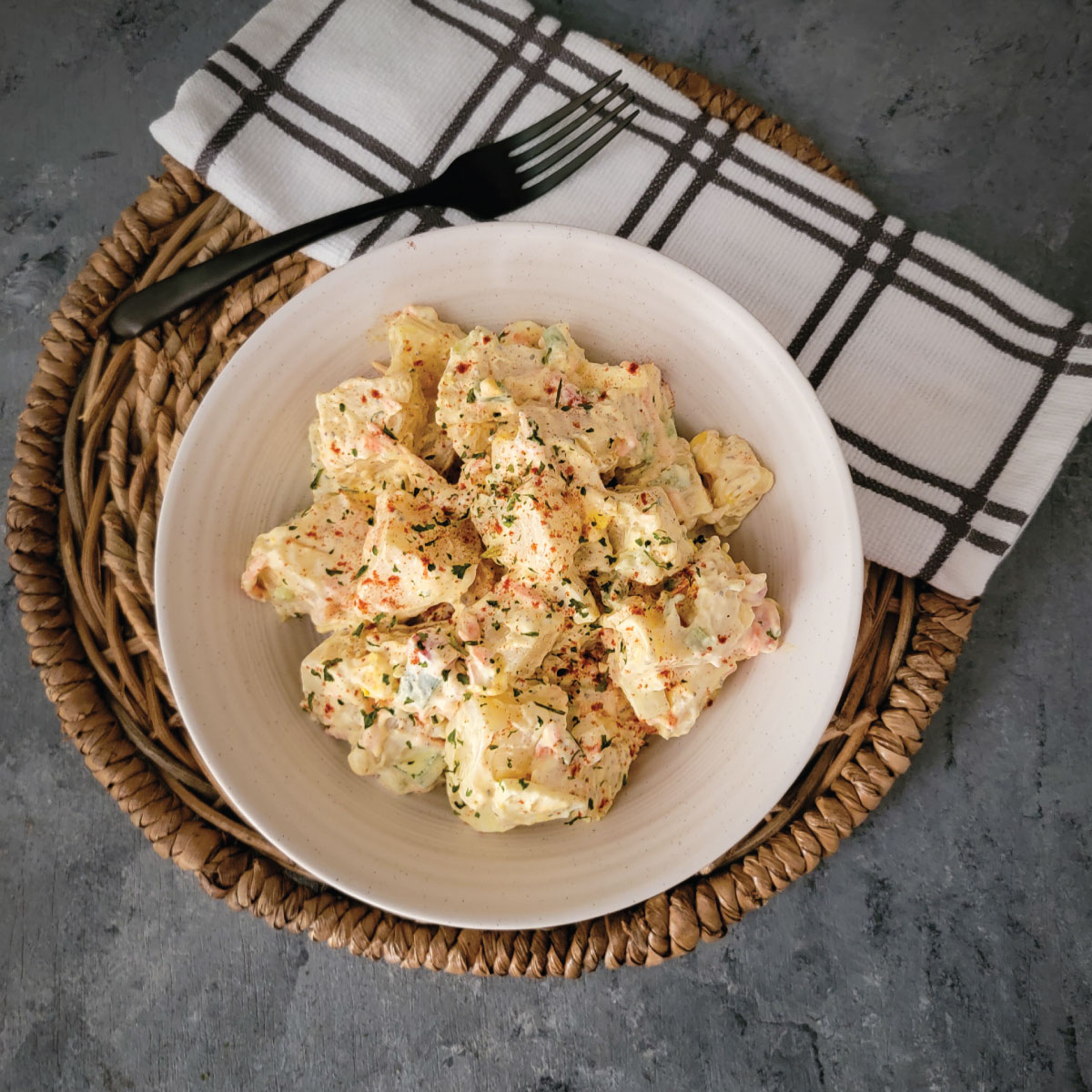 potato salad prepared and in the bowl ready to be eaten.