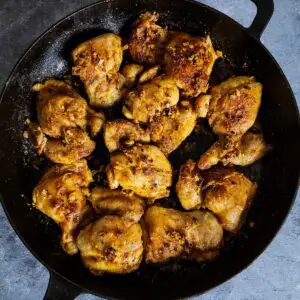 Chicken thighs in a pan ready to be served