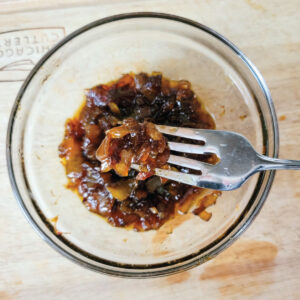 onions caramelized in a sauce in a serving dish