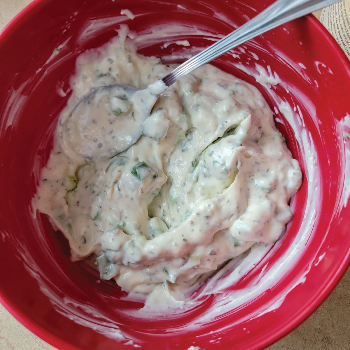 Dressing for the pasta salad prepared in a prep bowl