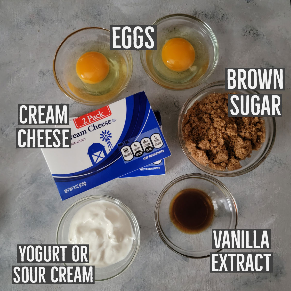 Ingredients shown for cheesecake layer - eggs, cream cheese, brown sugar, vanilla extract and yogurt.