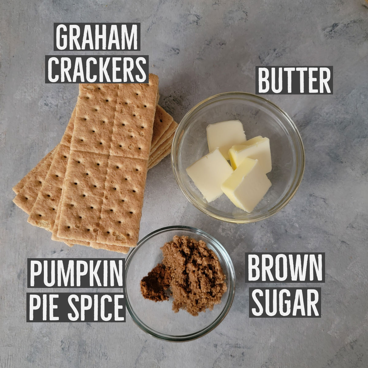 Ingredients shown for crust - graham crackers, butter, brown sugar and pumpkin pie spice.