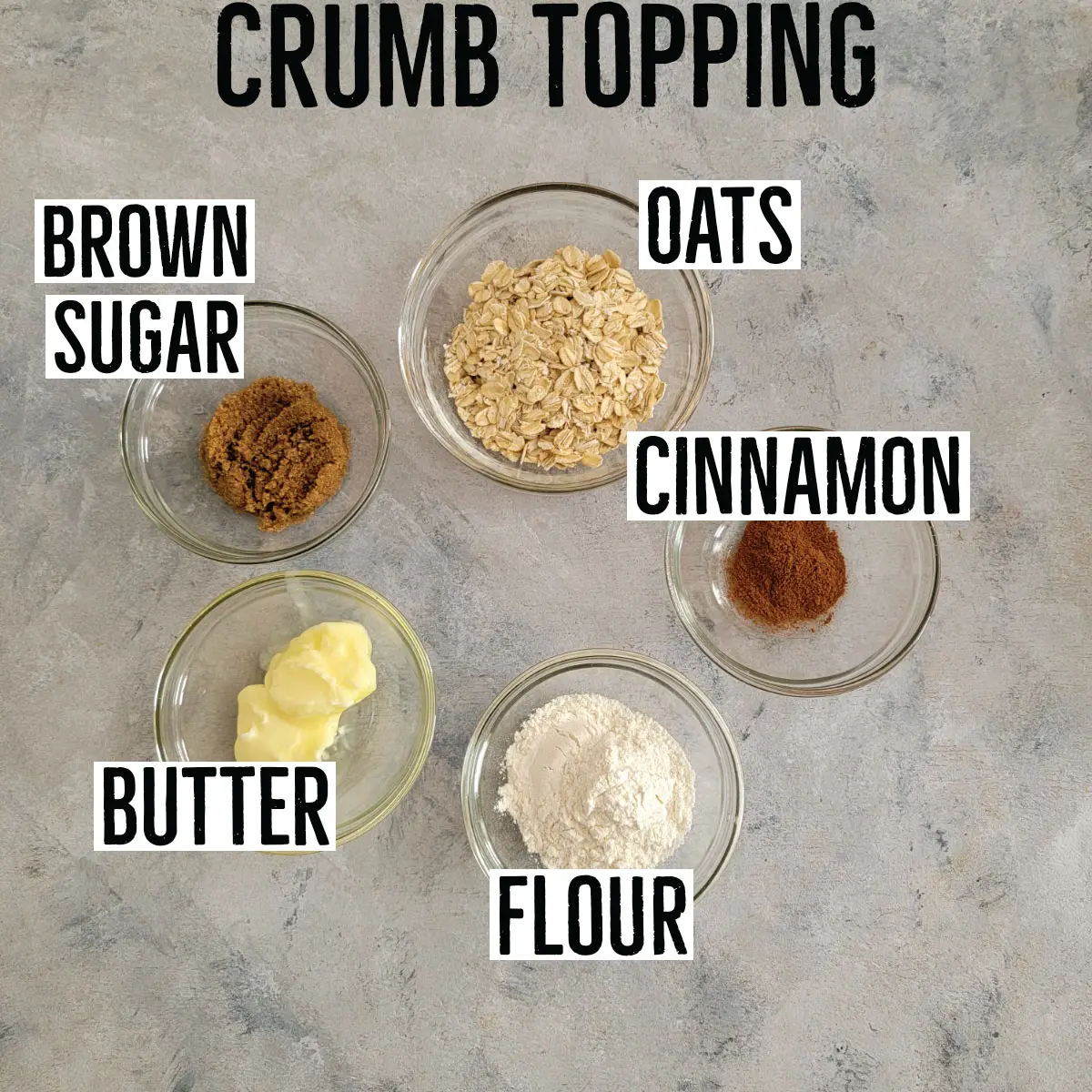 Crumb topping ingredients labeled in prep bowls - brown sugar, oats, cinnamon, butter and flour.