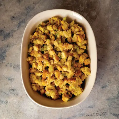 Stuffing in a baking dish after cooking ready to serve.