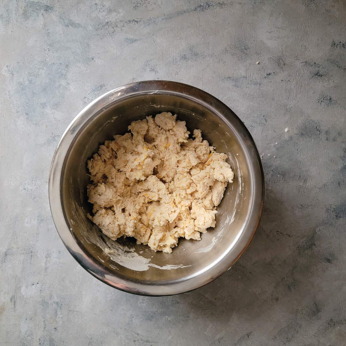 Biscuit dough in a mixing bowl after mixing all ingredients.