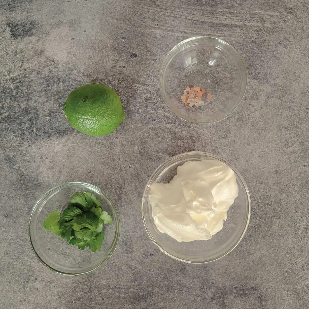 Ingredients prepped for the sour cream mixture - cilantro, sour cream, sea salt and lime.