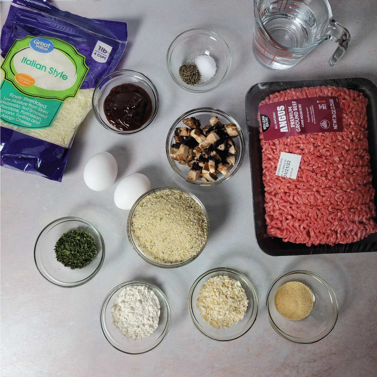 Ingredients prepped in bowls for making the meatloaf.