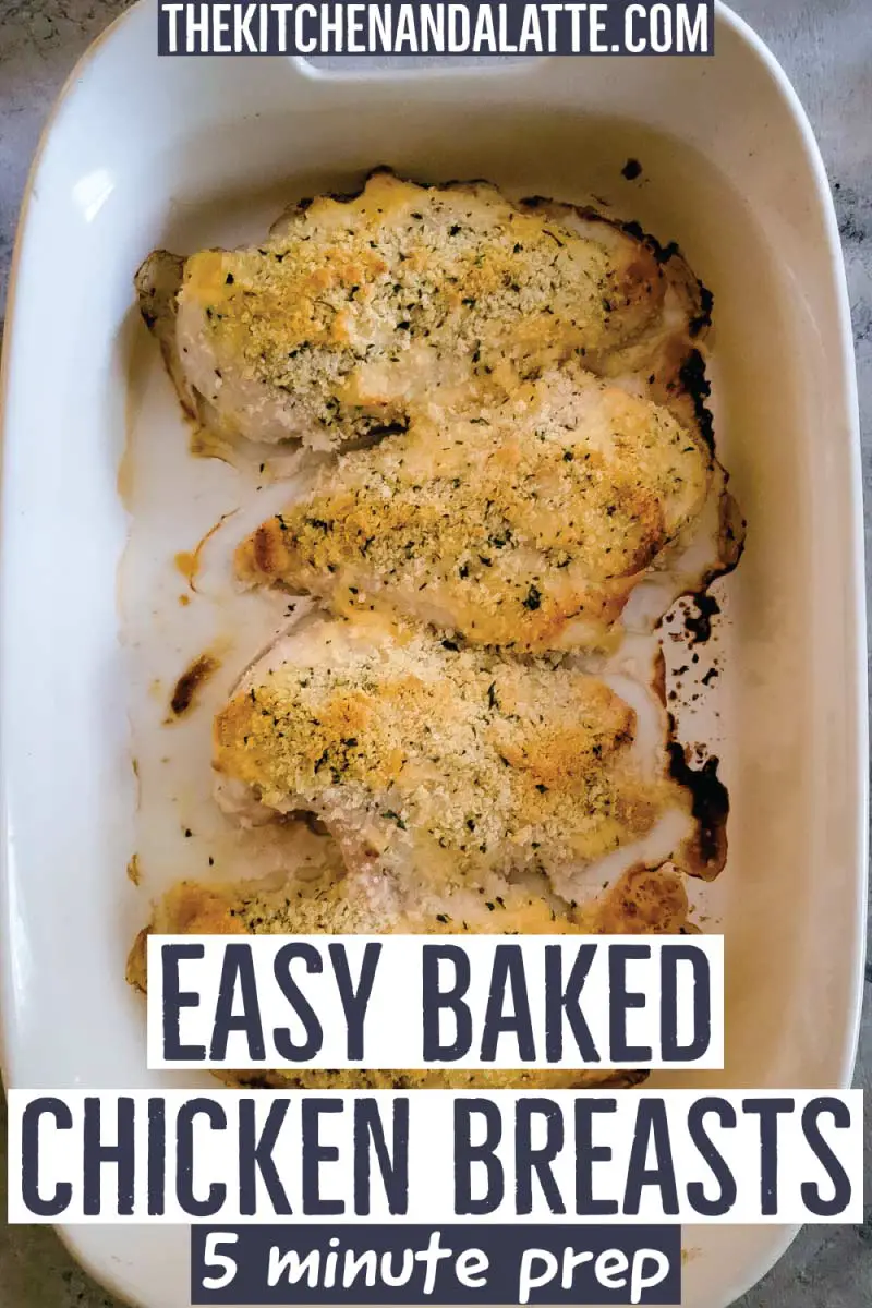 Chicken breasts with parmesan cheese, mayo and breadcrumbs in a baking dish resting before serving.