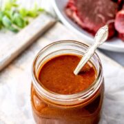 Marinade for steak prepared in a glass jar ready to use.