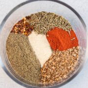 Spices added to a prep bowl for the steak seasoning.