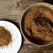 Prepared coffee rub being spooned out of a dish.