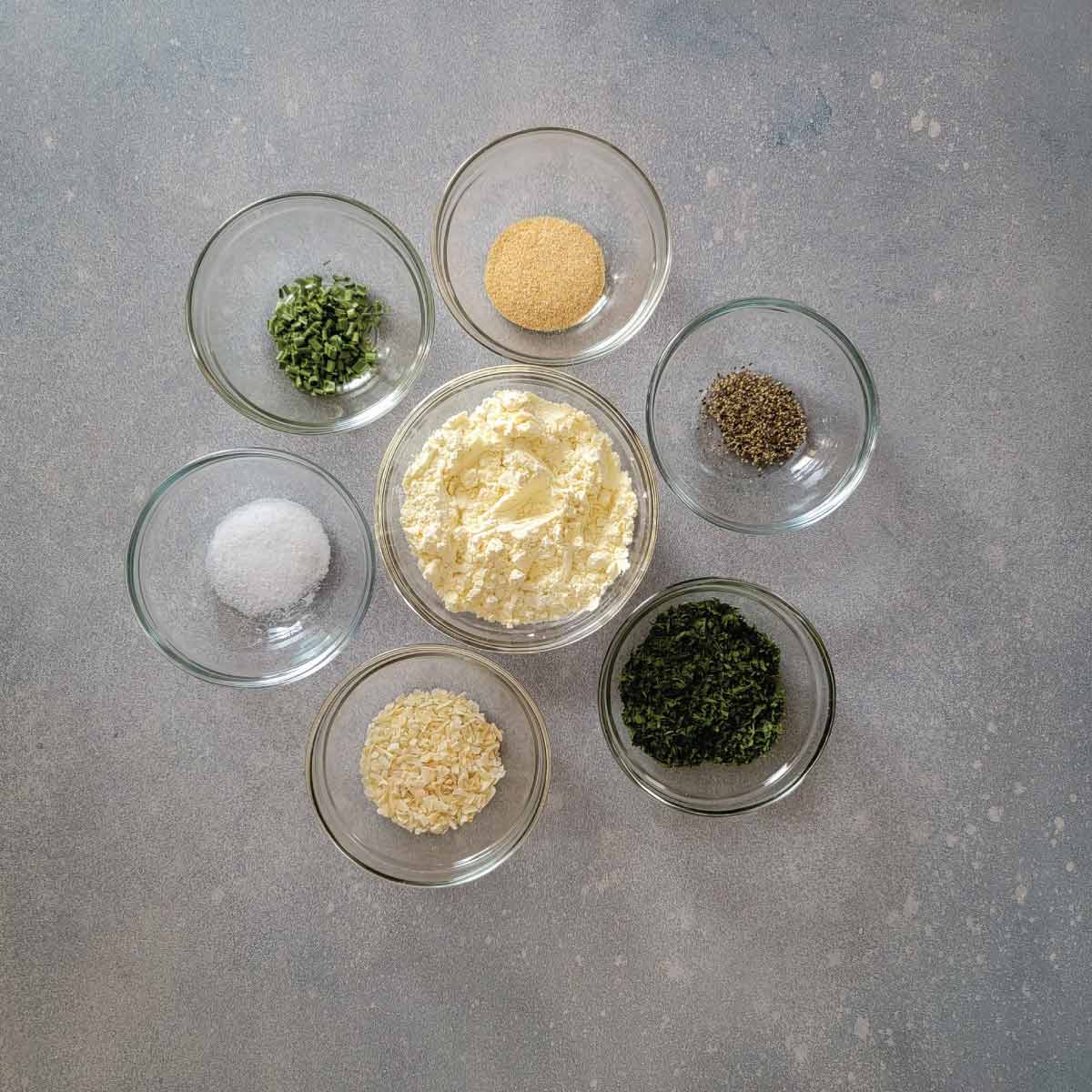 Ingredients for the seasoning prepped in small prep bowls.