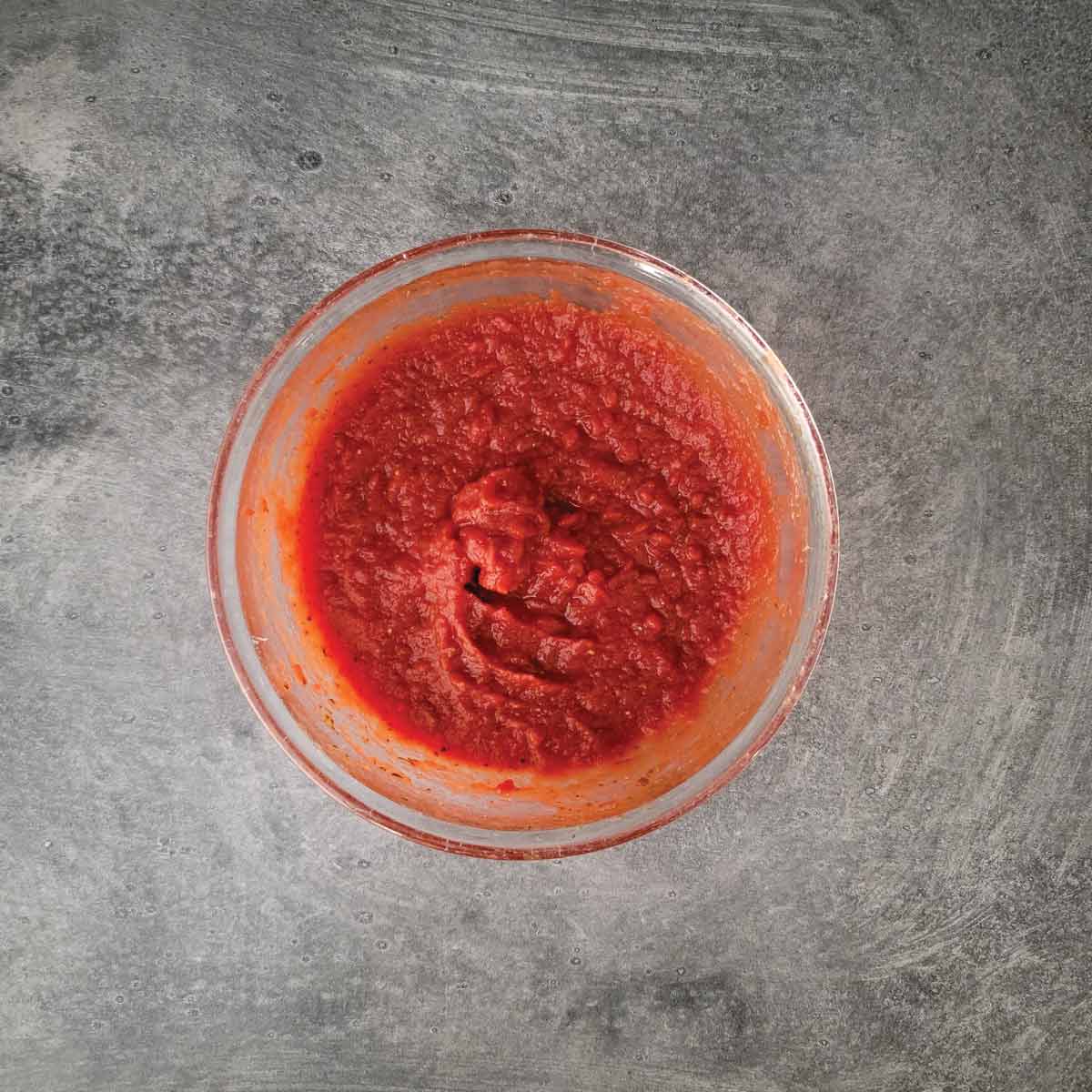 Homemade pizza sauce in a bowl ready to use.