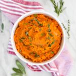 Mashed sweet potatoes in a serving bowl ready to serve.