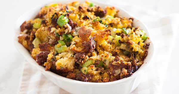 cornbread stuffing with sausage in a serving dish ready to serve.