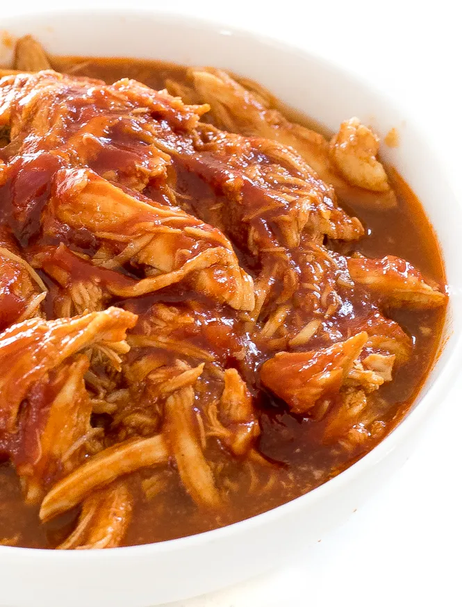 Shredded BBQ chicken in a serving bowl ready to be served.