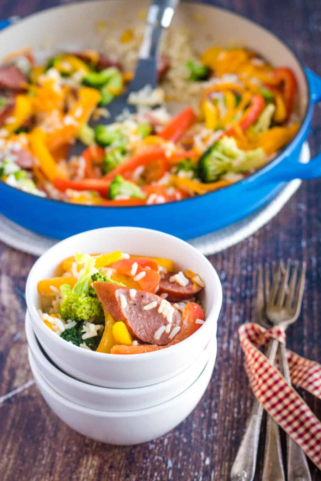 Smoked sausage and rice skillet in a serving dish ready to eat.